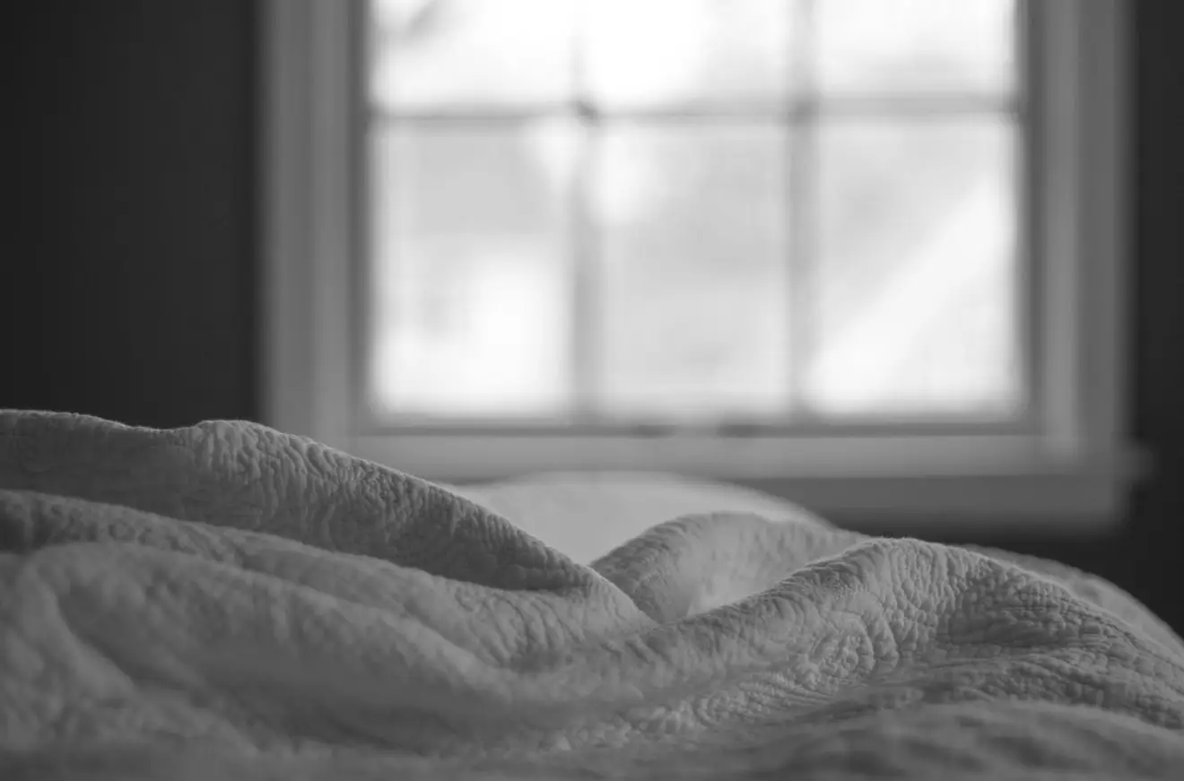Bed linen in morning window light