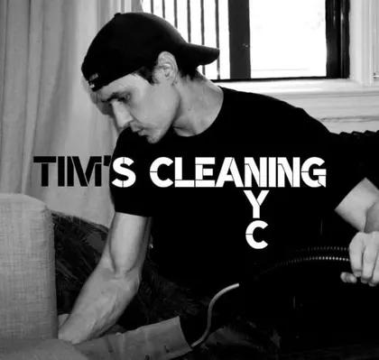 Tim on a job, working the extraction wand over a sofa cushion
